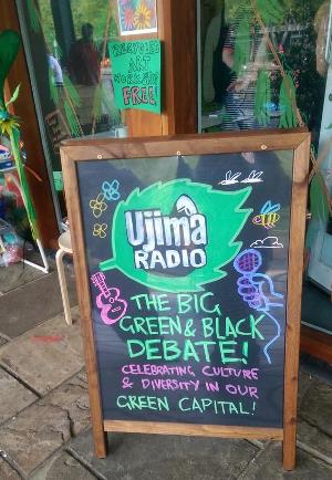 Green and Black debate posterboard. Image credit Ujima Radio